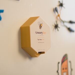 GroceryBee mounted on a fridge door.
